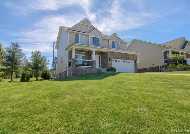 Photo 2 of Single Family Residence at 30932 Asbury Hl Dr, New Hudson, MI 48165 | MLS# 60999205 |  | Sold on 2026-06-29