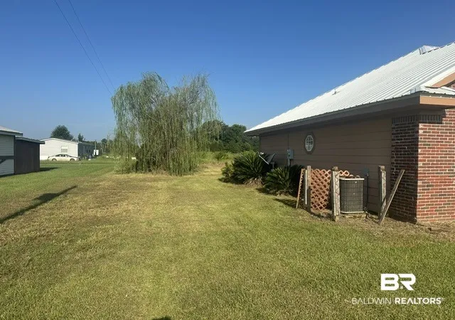 Photo 2 of Single family home for sale at 8821 Jack Springs Rd, Atmore, AL 36502 | MLS# 409847 | Listing updated on 2026-08-29