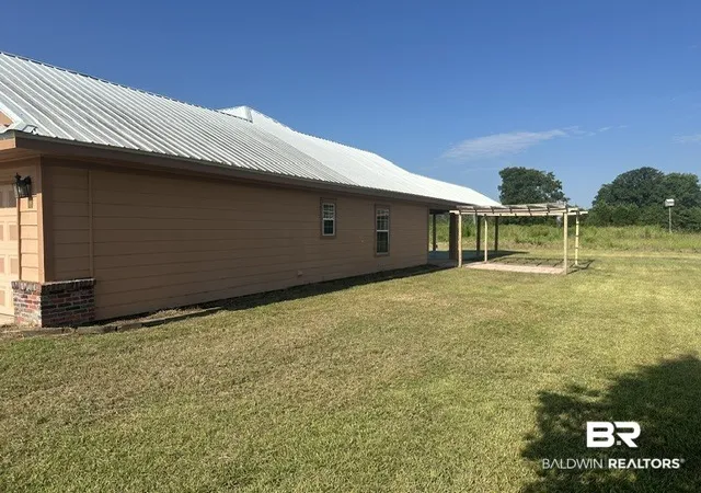 Photo 3 of Single family home for sale at 8821 Jack Springs Rd, Atmore, AL 36502 | MLS# 409847 | Listing updated on 2026-08-29