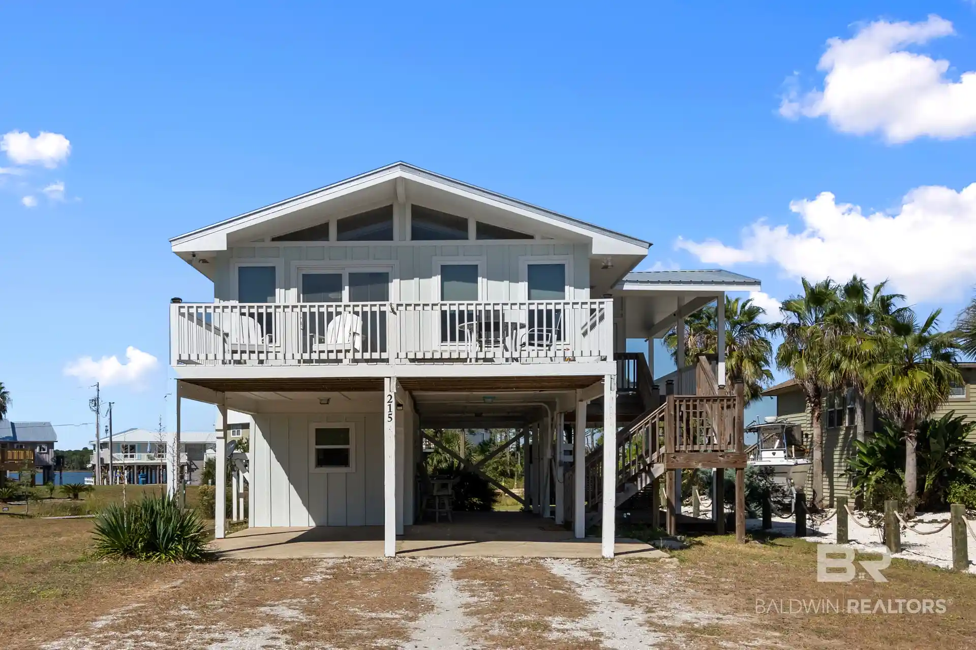 Photo 1 of Single family home for sale at 215 Shoreland Cir, Gulf Shores, AL 36542 | MLS# 412082 | Listing updated on 2026-10-19