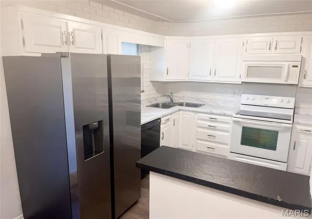 Photo 2 of Single family home for sale at 4917 Hill Dr, Godfrey, IL 62035 | MLS# MIS26064816 | Listing updated on 2026-10-08