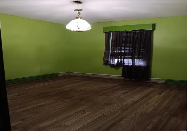 Photo 4 of Single Family Residence at 4869 Carter Ave, Saint Louis, MO 63115 | MLS# MIS24026941 | | Sold on 2024-10-10
