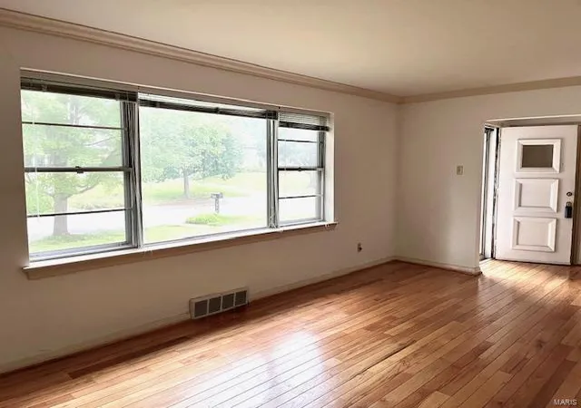 Photo 3 of Single Family Residence at 8719 Washington Ave, Saint Louis, MO 63124 | MLS# MIS24051818 | | Sold on 2024-10-10