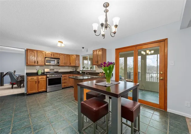 Photo 3 of Single Family Residence at 13317 East Ln, Saint Louis, MO 63128 | MLS# MIS25012573 | | Sold on 2025-05-21