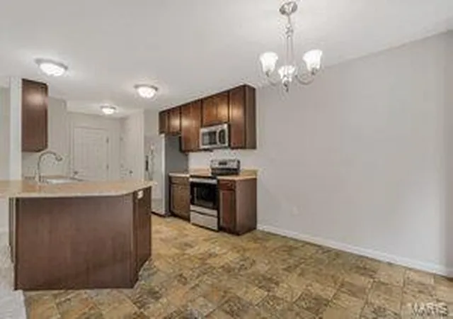 Photo 2 of Townhouse for sale at 5117 Tesson Grove Dr, Saint Louis, MO 63128 | MLS# 25027310 | Listing updated on 2025-04-30
