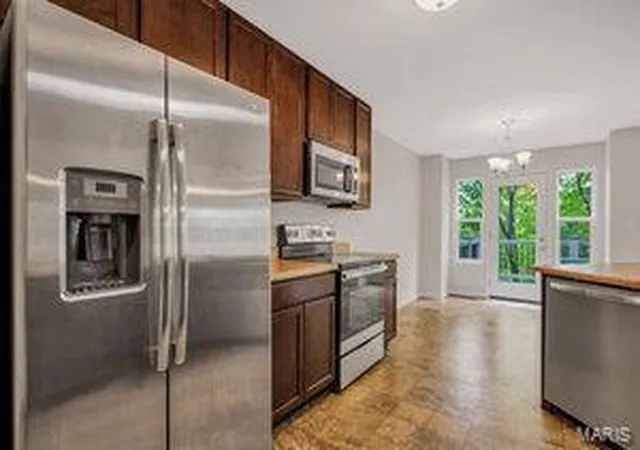 Photo 3 of Townhouse for sale at 5117 Tesson Grove Dr, Saint Louis, MO 63128 | MLS# 25027310 | Listing updated on 2025-04-30