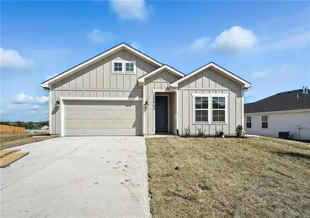 Photo 2 of Single family home for sale at 1834 Woodward Cir, Raymore, MO 64083 | MLS# 2633692 | Listing updated on 2026-10-07