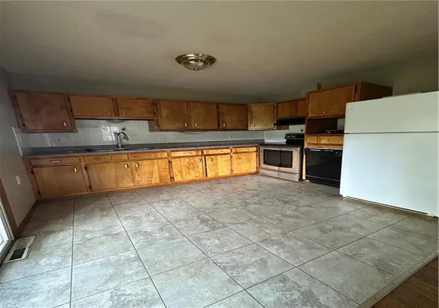 Photo 2 of Single family home for sale at 8404 Booth Ave, Raytown, MO 64138 | MLS# 2635480 | Listing updated on 2026-08-07
