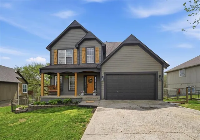 1st image of 215 E Whispering Hills Blvd, Lone Jack, MO 64070 | MLS# 2636817