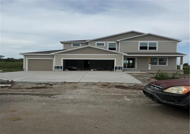 2nd image of 830 Reed Dr, Raymore, MO 64083 | MLS# 2636915