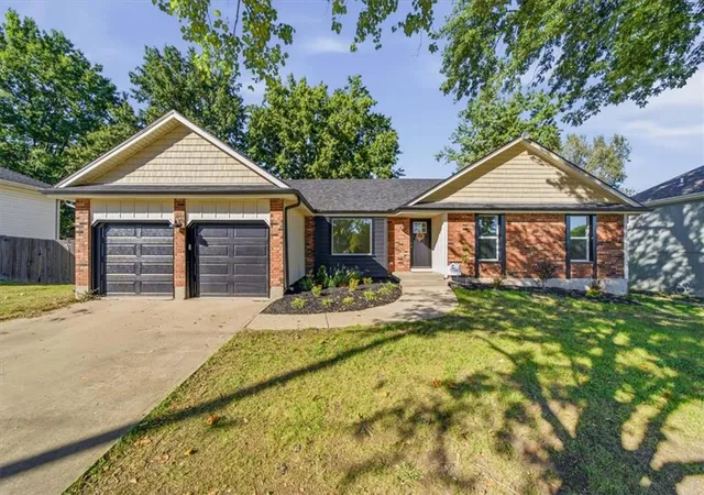 Single family home for sale at 1206 W Lucy Webb Rd, Raymore, MO 64083 | MLS# 2637477