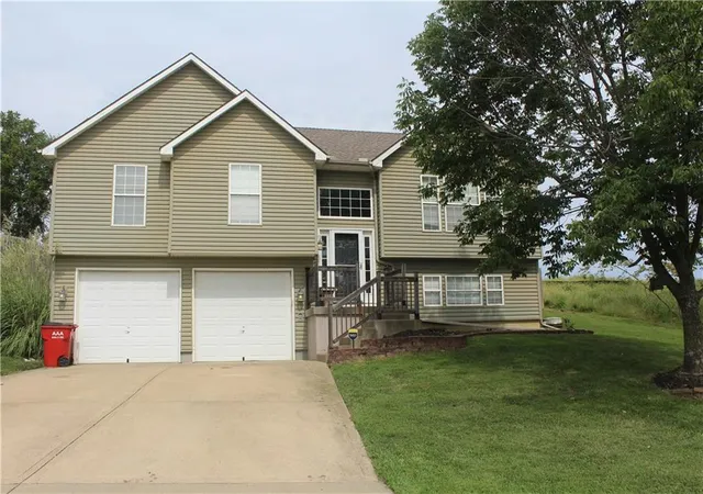 Photo 1 of Single family home for sale at 212 Whispering Hills Blvd, Lone Jack, MO 64070 | MLS# 2638482 | Listing updated on 2026-10-02