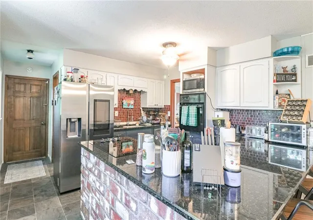 Photo 3 of Single family home for sale at 324 Goodrich Dr, Warrensburg, MO 64093 | MLS# 2639472 | Listing updated on 2026-09-03