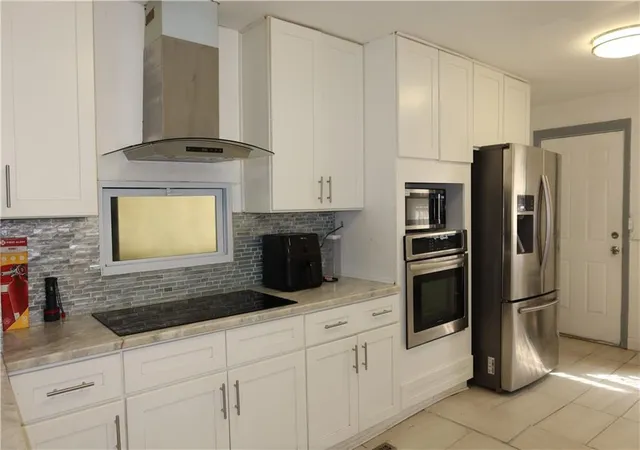 Photo 4 of Single family home for sale at 147 Kensington Ave, Kansas City, MO 64123 | MLS# 2643151 | Listing updated on 2026-09-20