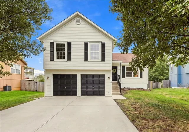 Single family home for sale at 718 Shiloh Dr, Raymore, MO 64083 | MLS# 2644914