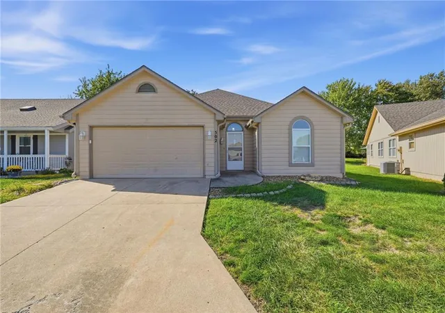 Single family home for sale at 502 S Saturn Dr, Raymore, MO 64083 | MLS# 2646277