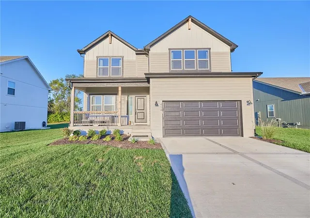 Single family home for sale at 404 Woodview Dr, Raymore, MO 64083 | MLS# 2646332