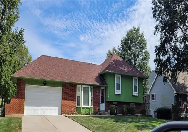 Photo 2 of Single family home for sale at 405 S Park Dr, Raymore, MO 64083 | MLS# 2646806 | Listing updated on 2026-10-18