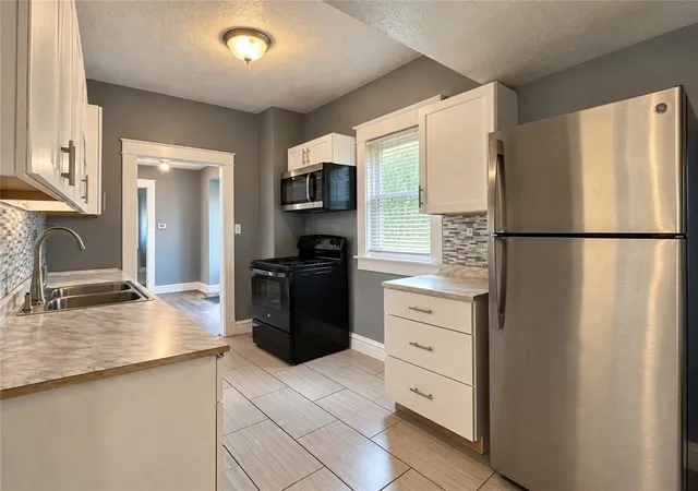 Photo 2 of Single family home for sale at 2310 Quincy St, Kansas City, MO 64127 | MLS# 2646863 | Listing updated on 2026-10-20