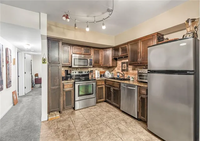 Photo 2 of Condo for sale at 4511 Headwood Dr #10, Kansas City, MO 64111 | MLS# 2647634 | Listing updated on 2026-10-28