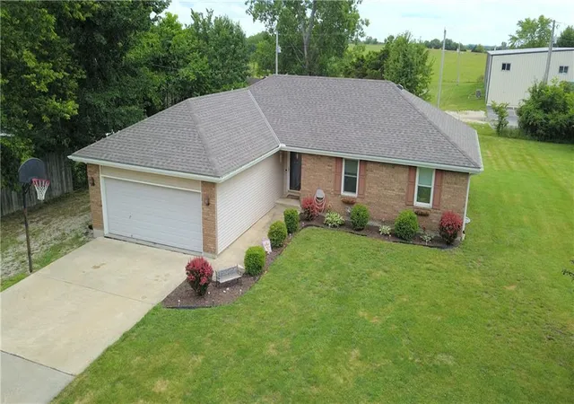 Single family home for sale at 411 10th Street, Garden City, MO 64747 | MLS# 2648072