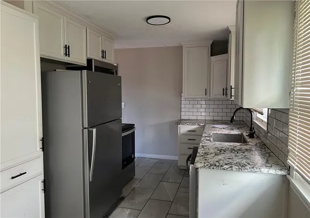 Photo 3 of Single family home for sale at 502 NW Central St, Lees Summit, MO 64063 | MLS# 2648408 | Listing updated on 2026-10-25
