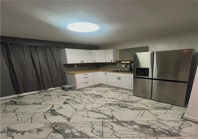 Photo 3 of Single family home for sale at 4031 S Benton Ave, Kansas City, MO 64130 | MLS# 2648411 | Listing updated on 2026-10-23
