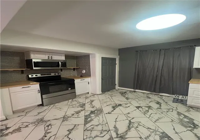 Photo 4 of Single family home for sale at 4031 S Benton Ave, Kansas City, MO 64130 | MLS# 2648411 | Listing updated on 2026-10-23