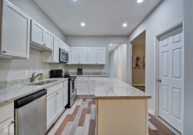 Photo 3 of Single family home for sale at 2450 Carrollton Ave, Indianapolis, IN 46205 | MLS# 22086393 | Listing updated on 2026-07-16