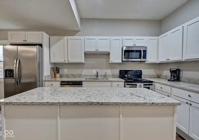 Photo 3 of Single family home for sale at 2450 Carrollton Ave, Indianapolis, IN 46205 | MLS# 22086393 | Listing updated on 2026-07-16