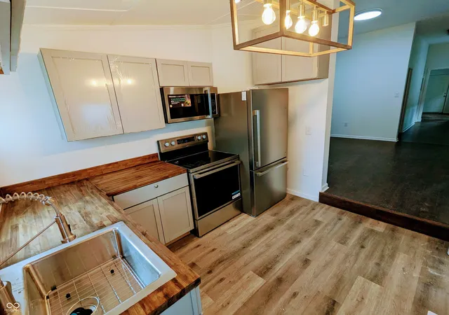 Photo 3 of Single family home for sale at 221 Kansas St, Indianapolis, IN 46225 | MLS# 22115699 | Listing updated on 2026-08-04
