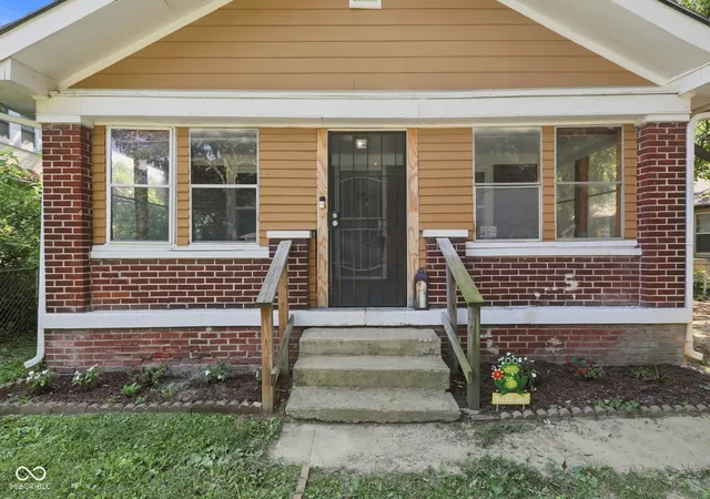 Photo 1 of Single family home for sale at 415 S Arlington Ave, Indianapolis, IN 46219 | MLS# 22116440 | Listing updated on 2026-09-30