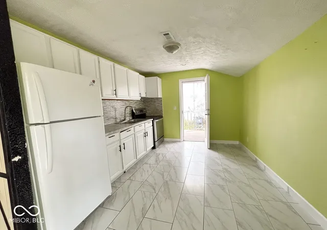 Photo 3 of Single family home for sale at 5007 E 34th Street, Indianapolis, IN 46218 | MLS# 22127216 | Listing updated on 2026-10-23