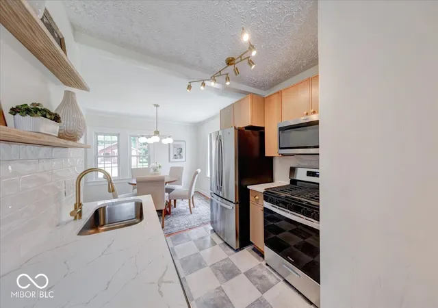Photo 3 of Single family home for sale at 102 N Sheridan Ave, Indianapolis, IN 46219 | MLS# 22127361 | Listing updated on 2026-09-21