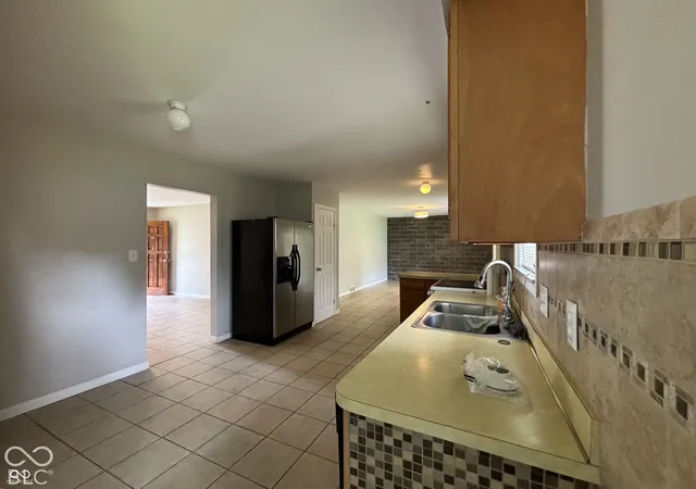 Photo 2 of Single family home for sale at 1345 Carroll White Dr, Indianapolis, IN 46219 | MLS# 22130928 | Listing updated on 2026-10-10