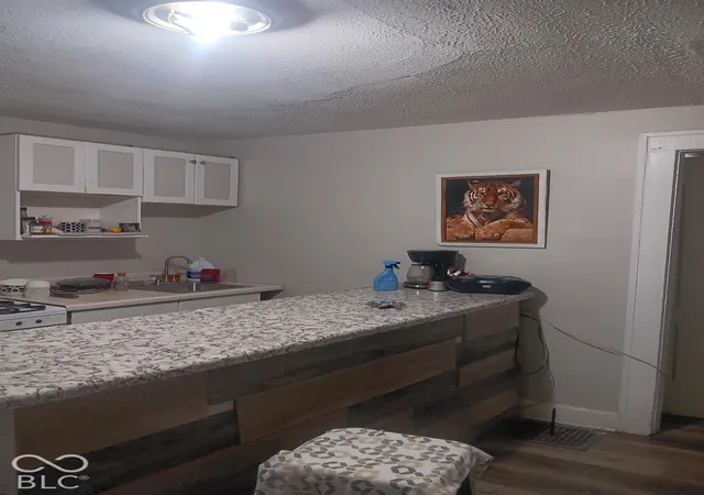 Photo 2 of Multi family home for sale at 933 N Ewing St, Indianapolis, IN 46201 | MLS# 22132400 | Listing updated on 2026-10-28