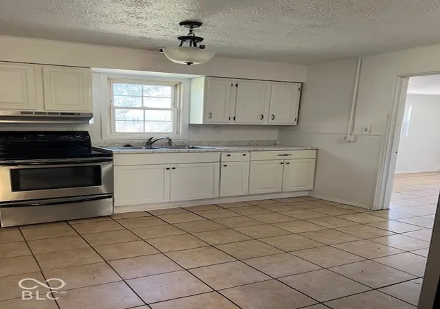 Photo 4 of Single family home for sale at 2413 N Kenyon St, Indianapolis, IN 46219 | MLS# 22133170 | Listing updated on 2026-10-27