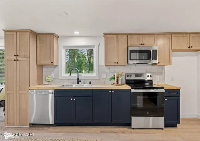 Photo 3 of Single family home for sale at 2000 Wildwood Ln, Anchorage, AK 99517 | MLS# 26-5396 | Listing updated on 2026-10-03