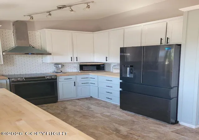 Photo 4 of Single family home for sale at 12222 Woodward Dr, Anchorage, AK 99516 | MLS# 26-8964 | Listing updated on 2026-09-12