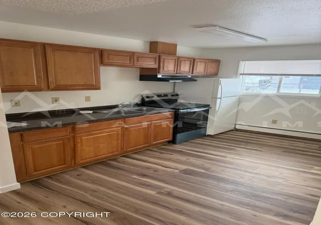 Photo 4 of Multi family home for sale at 3147 Peterkin Ave, Anchorage, AK 99508 | MLS# 26-8948 | Listing updated on 2026-08-31
