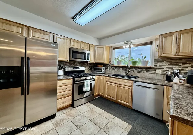 Photo 2 of Sale Pending at 1612 Cara Loop, Anchorage, AK 99515 | MLS# 26-9050 | Listing updated on 2026-09-04