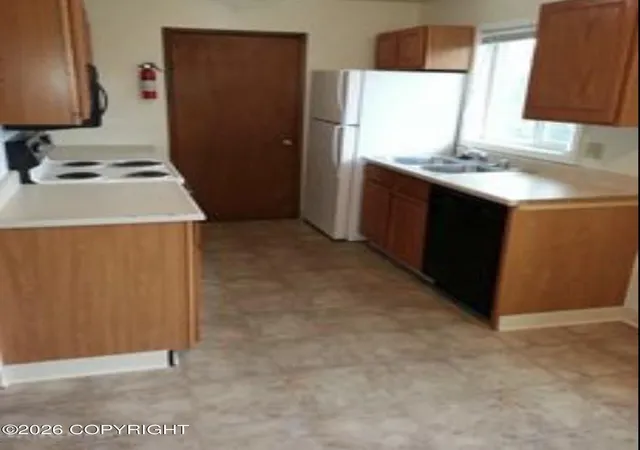 Photo 3 of Multi family home for sale at 608 Mumford St, Anchorage, AK 99508 | MLS# 26-10287 | Listing updated on 2026-08-12