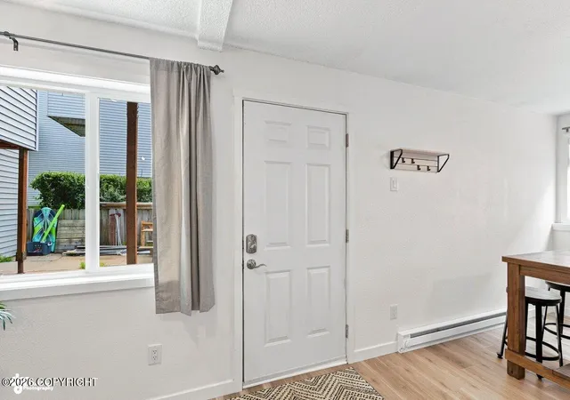 Photo 2 of Condo for sale at 7061 Weimer Rd #1, Anchorage, AK 99502 | MLS# 26-10373 | Listing updated on 2026-08-31