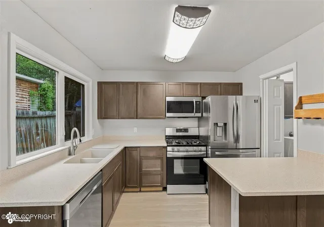 Photo 2 of Sale Pending at 1065 E 17th Avenue, Anchorage, AK 99501 | MLS# 26-10601 | Listing updated on 2026-08-23