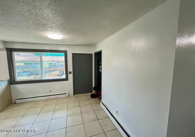 Photo 4 of Multi family home for sale at 4208 Mcphee Ave, Anchorage, AK 99508 | MLS# 26-10913 | Listing updated on 2026-10-07