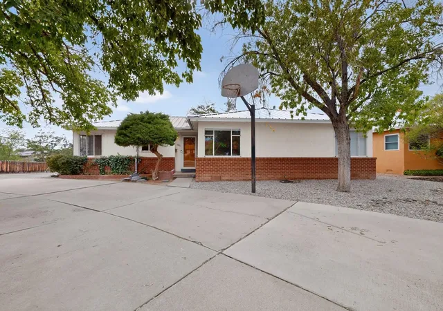 Photo 2 of Single family home for sale at 1401 Dartmouth Dr Ne, Albuquerque, NM 87106 | MLS# 1107905 | Listing updated on 2026-08-16