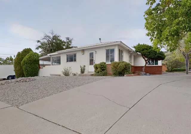 Photo 2 of Single family home for sale at 1401 Dartmouth Dr NE, Albuquerque, NM 87106 | MLS# 1107905 | Listing updated on 2026-08-16
