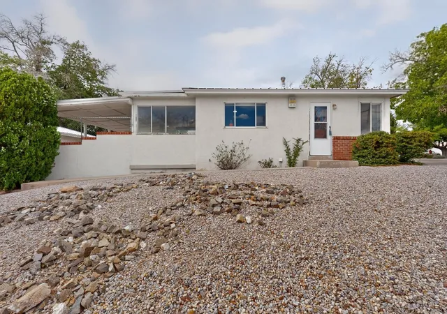 Photo 3 of Single family home for sale at 1401 Dartmouth Dr NE, Albuquerque, NM 87106 | MLS# 1107905 | Listing updated on 2026-08-16