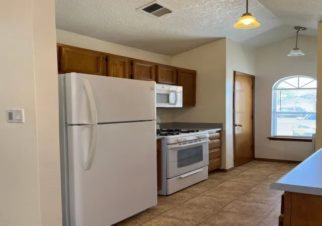 Photo 3 of Townhouse for sale at 5216 Chuckwagon Trl Nw, Albuquerque, NM 87120 | MLS# 1109874 | Listing updated on 2026-08-27