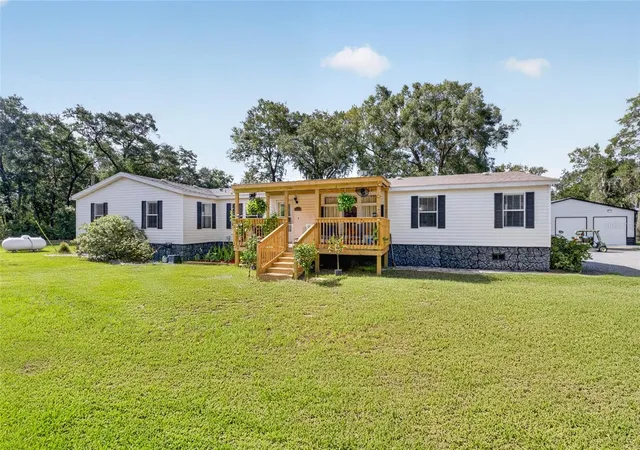 Photo 3 of Manufactured home for sale at 15680 SE 171st Lane, Weirsdale, FL 32195 | MLS# OM729050 | Listing updated on 2026-09-02